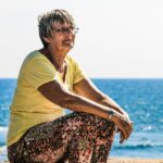 woman sitting on seashore